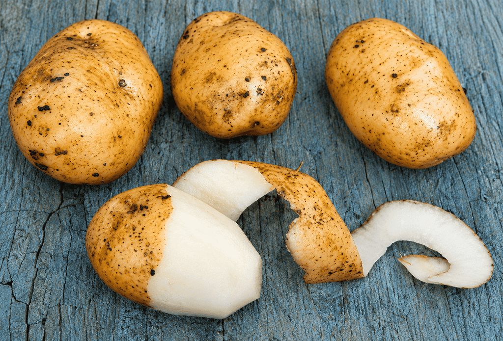 Speckled Potatoes on Weathered Blue Wood