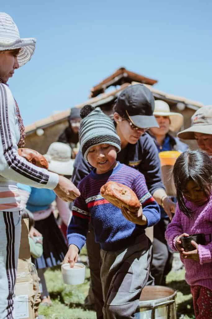 Chocolatada Kid receiving sweet bread