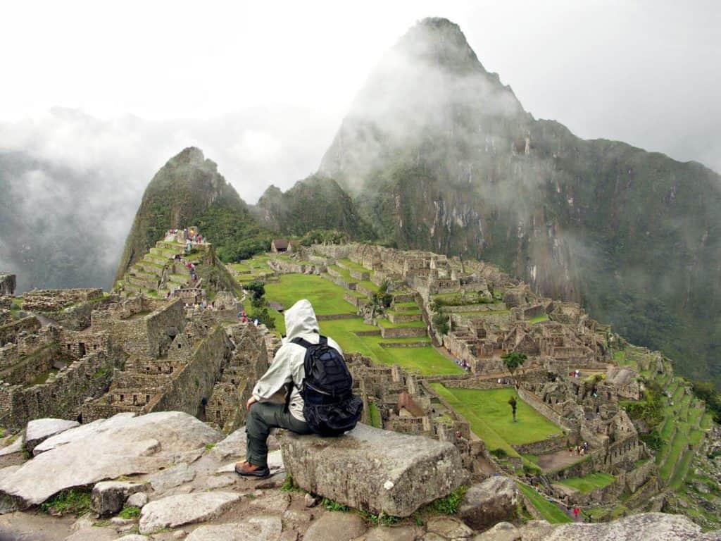 person from behind sitting in front of machu picchu,The Ultimate Machu Picchu Packing List [2024], bags for Machu Picchu, What to take to Machu Picchu
