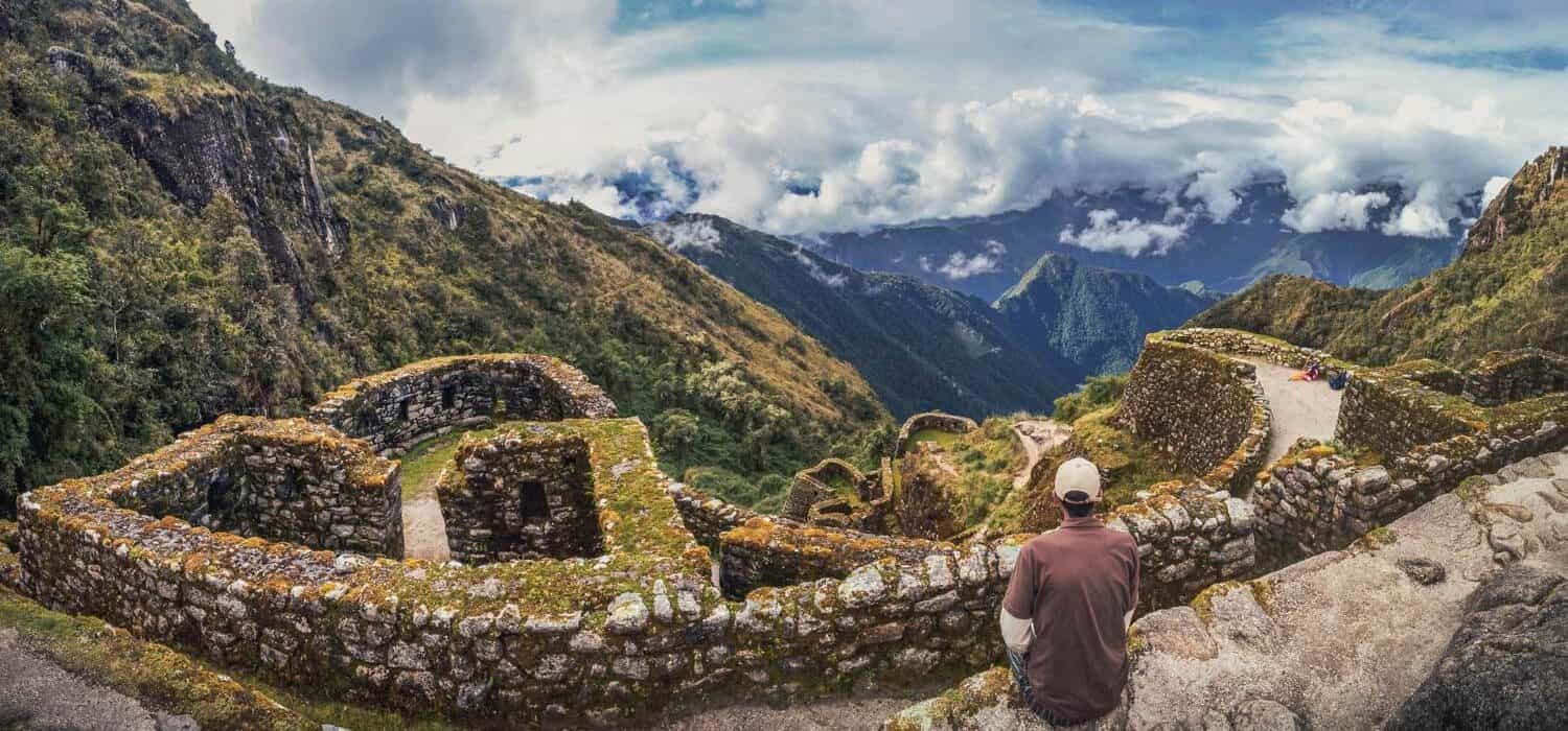 person enjoying views of inca site, private inca trail tour