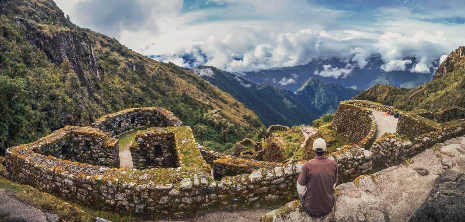 person enjoying views of inca site, private inca trail tour