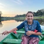 girl in a boat in amazon jungle