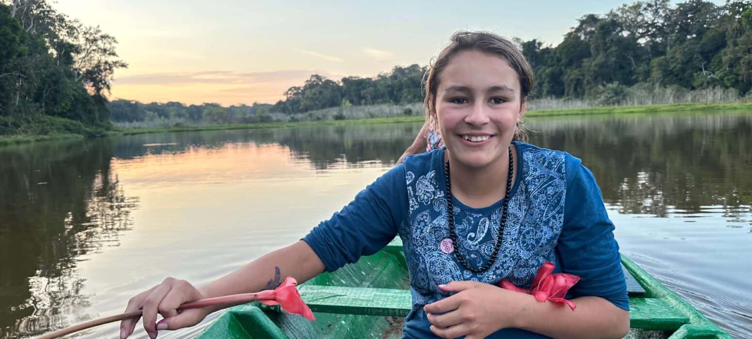 girl in a boat in amazon jungle