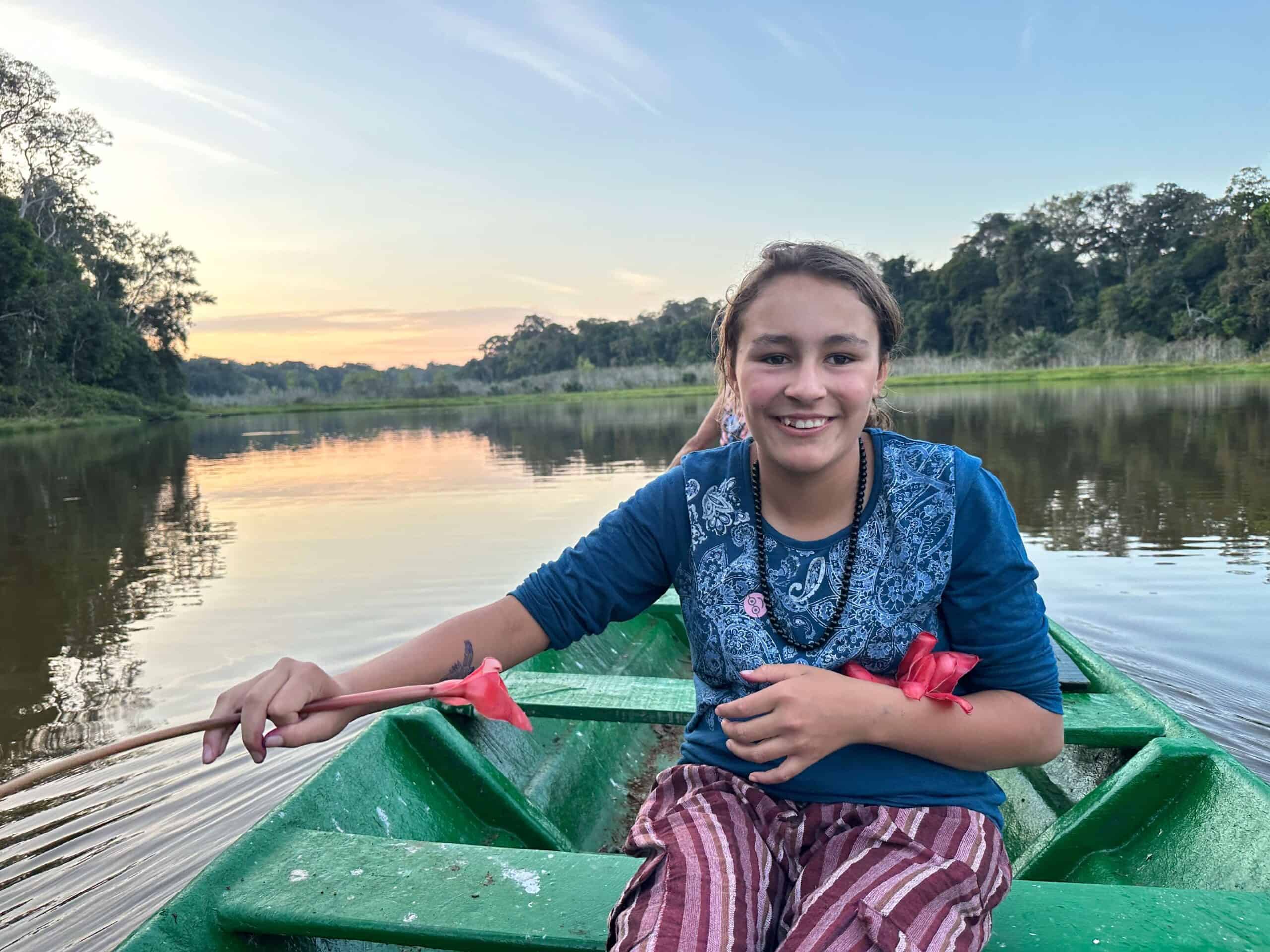 girl in a boat in amazon jungle