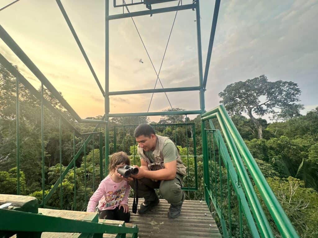 guide with little girl in peru jungle