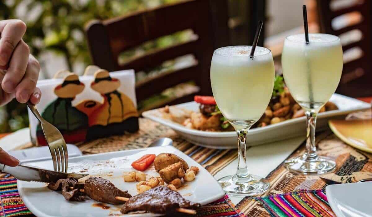 pisco sour cocktails and dish at restaurant
