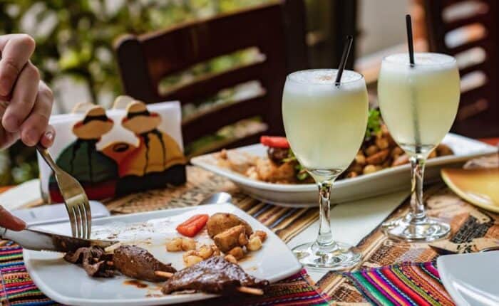 pisco sour cocktails and dish at restaurant