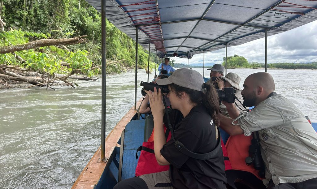 group taking a boat ride in the jungle